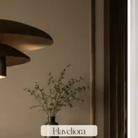 Playful sophisticated room with a sculptural pendant, strong geometry and edited warm materials.