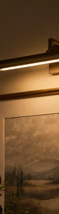 Picture light illuminating artwork without relying on ceiling lighting.